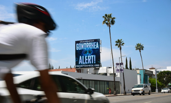 An AIDS Healthcare Foundation (AHF) billboard warning of a drug resistant gonorrhea on Sunset Boulevard