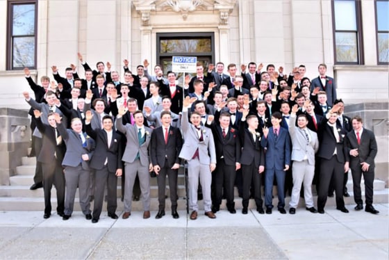 Image: Baraboo School District students appear to be make extremely inappropriate gestures during a class photo