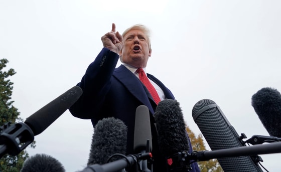 Image: President Trump talks to reporters as he departs the White House in Washington