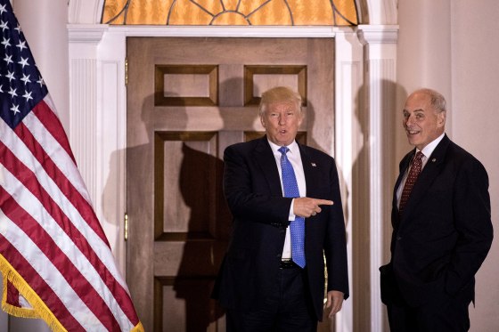 Image: Donald Trump points at John Kelly before their meeting at Trump International Golf Club in Bedminster, New Jersey, on Nov. 20, 2016.