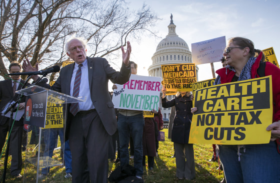 Image: Sen. Bernie Sanders joins protesters outside the Capitol as Republicans in the Senate work to pass a tax bill on Nov. 30, 2017.