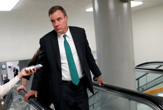 Senator Mark Warner speaks to the media at the Capitol on July 16, 2018.