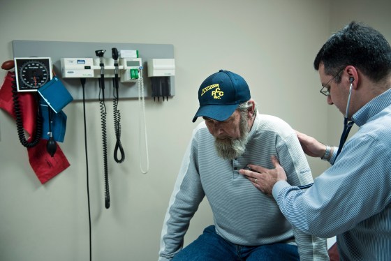 A lung cancer survivor is examined by a doctor at the Clay-Battelle Community Health Center in Blacksville, West Virginia, on March 21, 2017 .