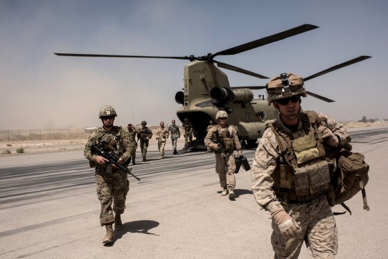 Image: U.S. troops walk off a helicopter at Camp Bost in Helmand Province, Afghanistan, on Sept. 11, 2017.