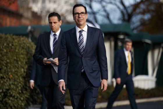 Image: Treasury Secretary Steve Mnuchin walks to talk with reporters at the White House on Dec. 3, 2018.