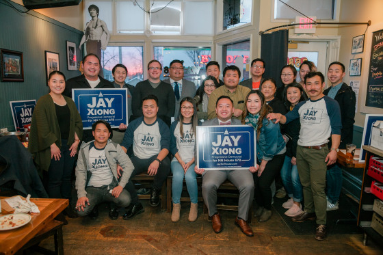 Image: Jay Xiong, center rear, newly elected to Minnesota's legislature, at a campaign event.