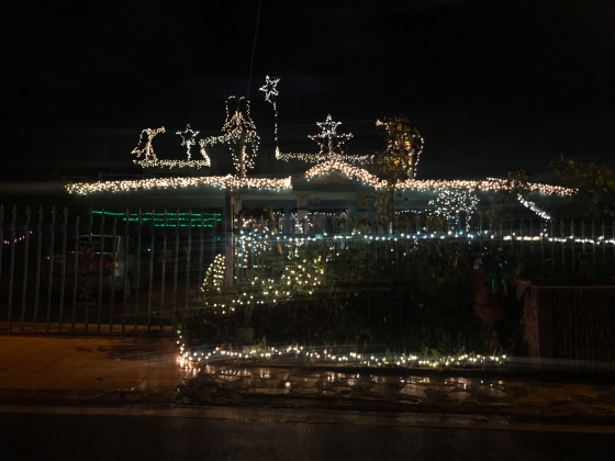 The Christmas lights of a house in Cupey, Puerto Rico shine at night on December 27, 2018.