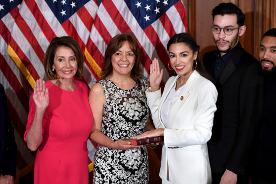 Image: Speaker of the House Nancy Pelosi performs a ceremonial swearing-in for U.S. House Representative Alexandria Ocasio-Cortez, D-NY