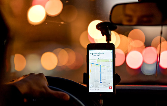 Image: A driver uses the Uber car service app in Washington, D.C., in 2017.