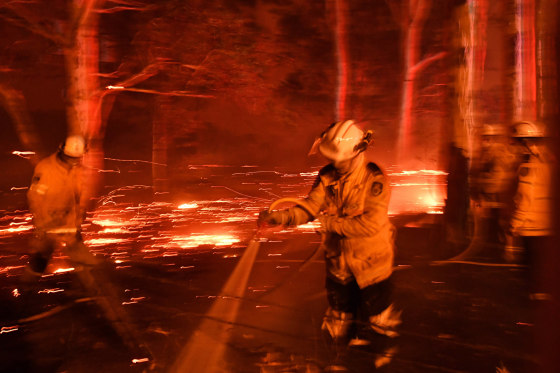 Image: Firefighters battle fires near the town of Nowra, Australia, on Dec. 31, 2019.