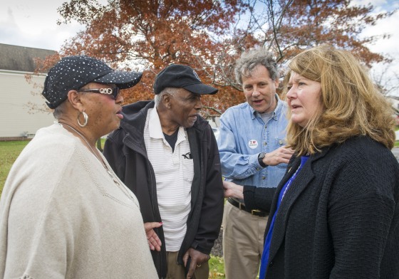 Emma Taylor, left and her husband Andrew, both of Cleveland, talk with Sen. Sherrod Brown, D-Ohio, and his wife Connie Schultz, right, after Brown and Schultz cast their ballots Nov. 6, 2018, in Cleveland.