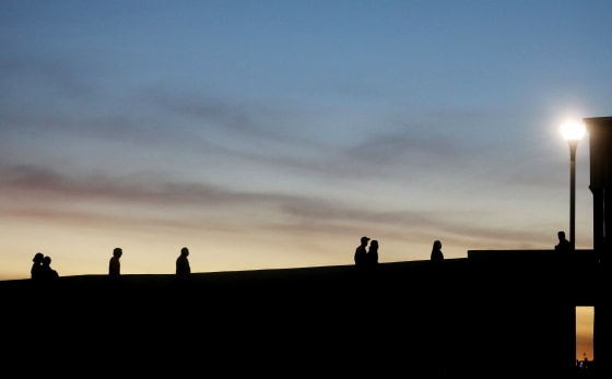 Image: People walk at the El Chapparal port of entry in Tijuana, Mexico, on Jan. 25, 2019.