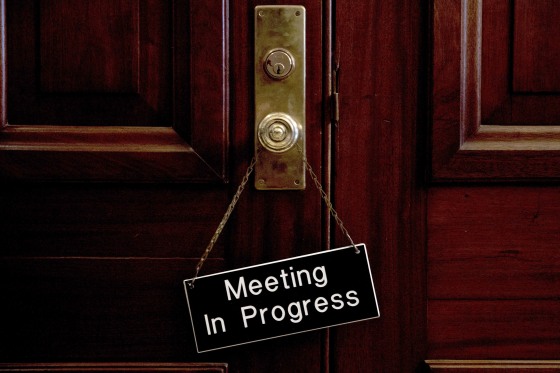 Image: A sign that reads \"Meeting In Progress\" hands on a door of a closed meeting room at the Capitol as bipartisan House and Senate bargainers trying to negotiate a border security compromise
