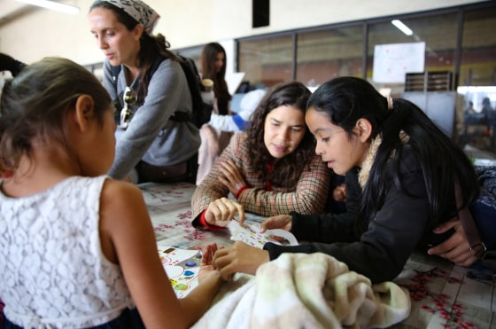 Image: America Ferrera speaks with migrants at a shelter in Tijuana, Mexico.