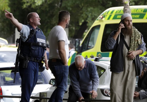 Image: Police attempt to clear people from outside a mosque in central Christchurch, New Zealand,