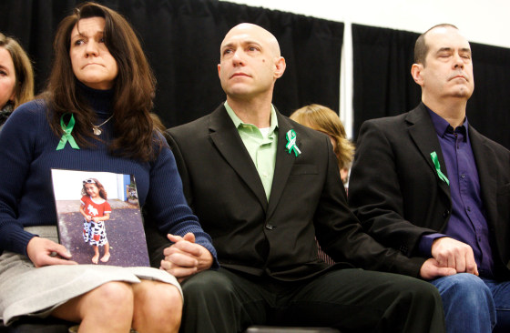 Image: Jennifer Hensel and Jeremy Richman, the parents of Avielle Richman, sit with David Wheeler at the launch of The Sandy Hook Promise in Newtown, Connecticut, on Jan. 14, 2013.