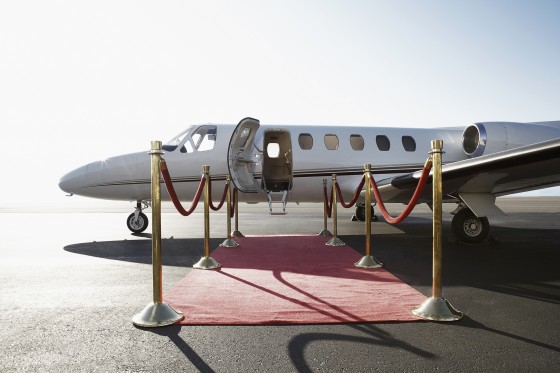 The superrich own jets and mega-yachts. The rich fly first class and buy sailboats.