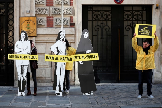 Image: Demonstrators from Amnesty International protest outside the Saudi Arabian Embassy on International Women's day in Paris