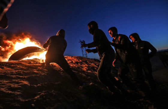 Palestinians protest near the fence along the border with Israel on March 19, 2019.