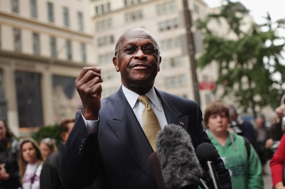 Image: Herman Cain speaks to the media outside Trump Tower before a meeting with Donald Trump in New York on Oct. 3, 2011.