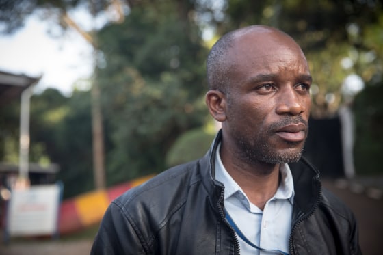Image: Gratien Zimy Ntezimisi, a refugee whistleblower, standing outside UNHCR's headquarters in Kampala, Uganda, in January 2019.