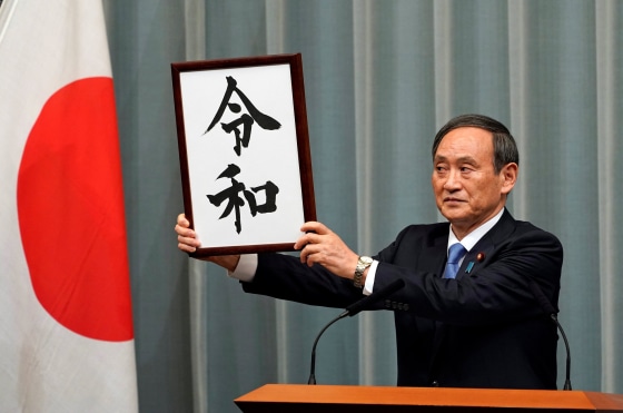 Image: Japan's Chief Cabinet Secretary Yoshihide Suga unveils 'Reiwa' as the new era name at the prime minister's office in Tokyo