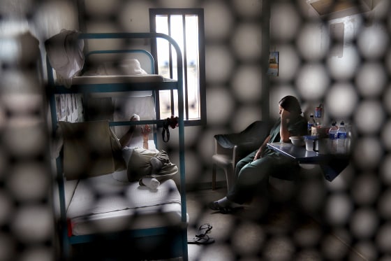 Image: Immigrants sit in a housing cell in the women's wing of a U.S. Immigration and Customs Enforcement detention facility in Eloy, Arizona, on July 30, 2010.