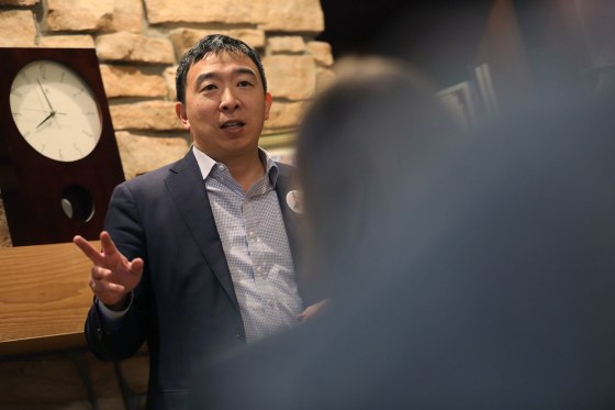 Image: U.S. 2020 Democratic presidential candidate Andrew Yang speaks at Potluck Insurgency, a local democratic activist event, at the home of one of its members in Iowa City, Iowa