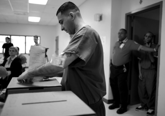 A Puerto Rican prison inmate casts his ballot, as prisoners voted two days early in the Democratic primary, at Correctional Institute 501, in Bayamon, Puerto Rico, on May 30, 2008.
