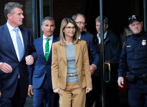 Image: Lori Loughlin and her husband, Mossimo Giannulli, leave federal court in Boston on April 3, 2019.