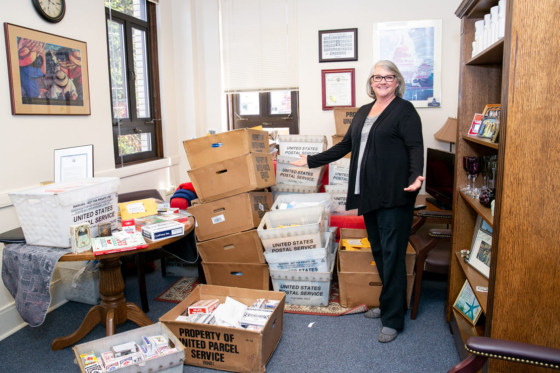 Image: Washington State Sen. Maureen Walsh and the decks of playing cards she's received in the mail in Olympia on April 23, 2019.