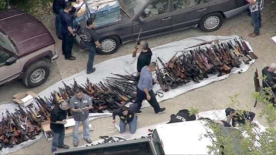 Law enforcement find a cache of weapons in a Holmy Hills home on Wednesday, May 8, 2019.