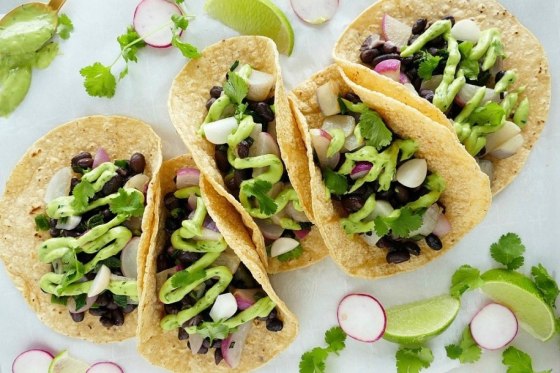 These radish and black bean tacos perfect example of how to look at your next taco Tuesday night through a Mediterranean lens.