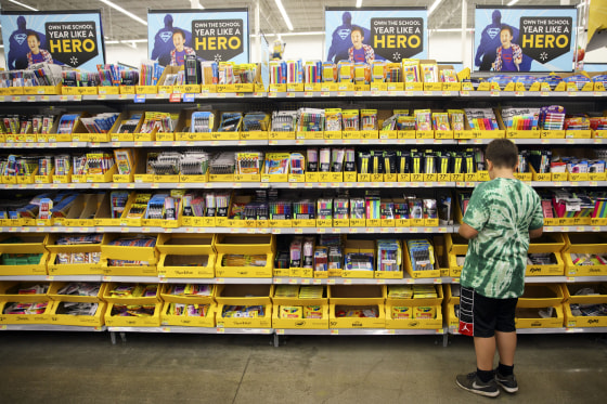 Image: A child browses school supplies