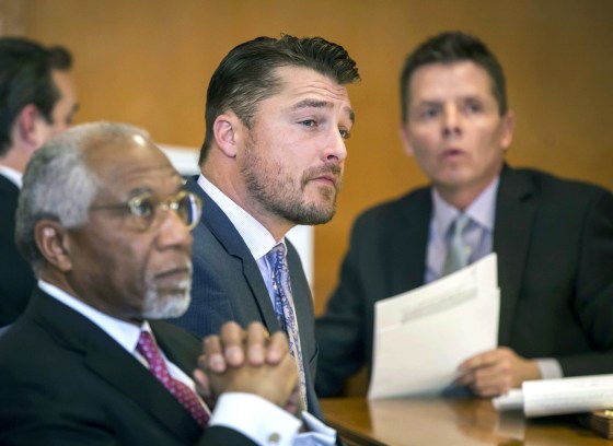 Iowa farmer and former TV reality show celebrity Chris Soules, center, listens during a hearing in court in Independence, Iowa, on Nov. 27, 2017.