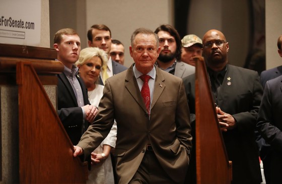 Image: Republican Senatorial candidate Roy Moore waits to be introduced to speak about the race against his Democratic opponent Doug Jones.