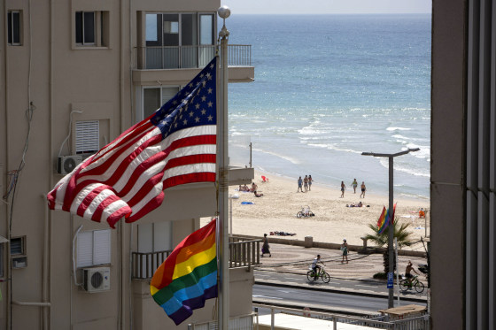 Image: A United States flag flies alongside a pride flag at the U.S. Embassy in Tel Aviv, Israel, in 2014.