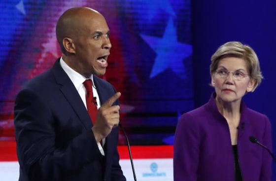 Image: Senator Cory Booker speaks as Senator Elizabeth Warren listens at the first U.S. 2020 presidential election Democratic candidates debate in Miami, Florida