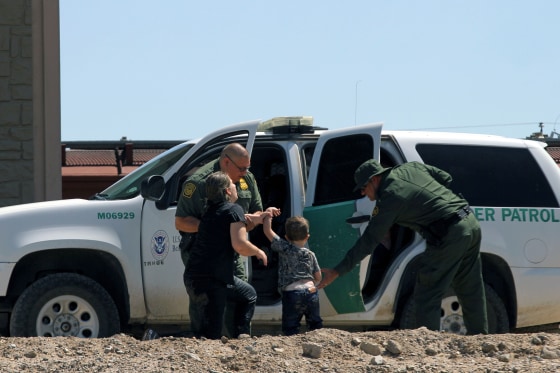 Migrants turn themselves into U.S. Border Patrol agents to claim asylum after crossing the Rio Grande on June 12, 2019.
