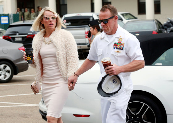Image: Navy Special Operations Chief Edward Gallagher walks into military court with his wife, Andrea Gallagher, in San Diego on June 24, 2019.
