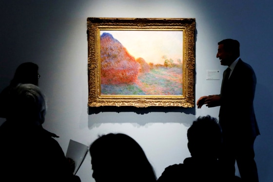 Image: A painting by Claude Monet, part of the Haystacks \"Les Meules\" series, at Sotheby's during a press preview for an art sale in New York on May 3, 2019.