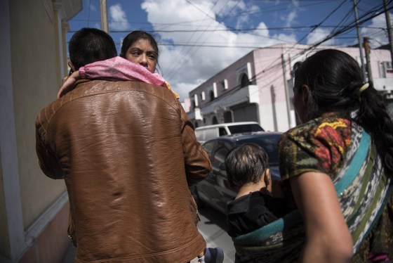 Image: Seven-year-old Mayra Cristina Gregorio Velasquez is carried by her father after they were reunited at the shelter \"Nuestras Raices,\" following her detention by U.S. immigration authorities, in Guatemala City