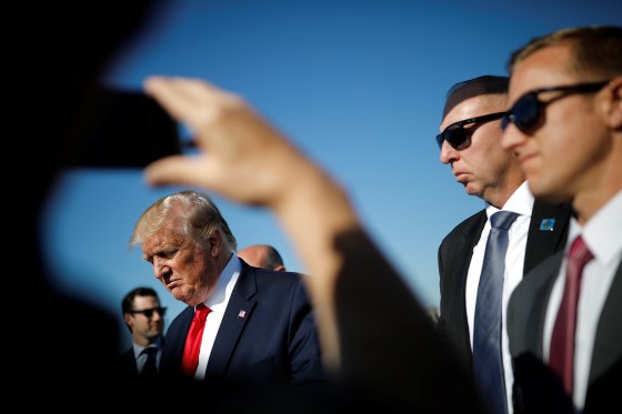Image: U.S. President Donald Trump greets officials after landing at Cleveland Hopkins International Airport in Cleveland, Ohio