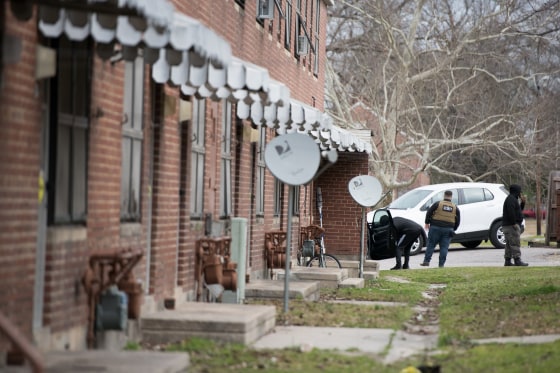Security workers patrol Allen Benedict Court on Feb. 10, 2019 in Columbia, South Carolina. The public housing complex was condemned and hundreds of residents forced to vacate after gas leaks caused the deaths of two men.