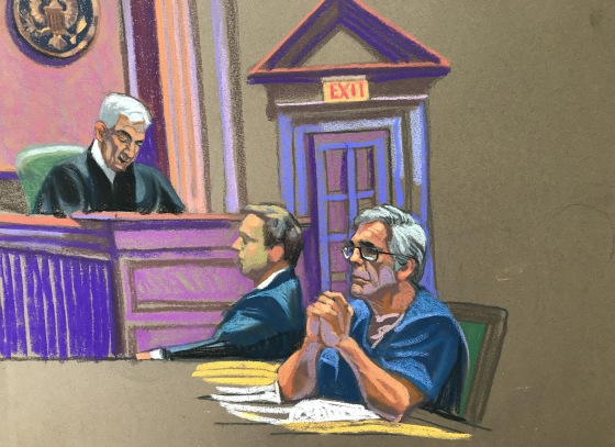 U.S. financier Jeffrey Epstein looks on near Judge Richard Berman during a bail hearing in his sex trafficking case in New York on July 18, 2019.