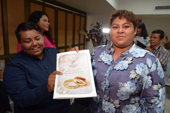 Image: Alexandra Chavez, left, and Michelle Aviles celebrate being married during Ecuador's first same sex marriage at a registry office in Guayaquil o