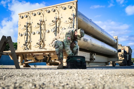 Image: U.S. Army soldier looks in his tool bag during a routine maintenance inspection of a THAAD weapon system on Andersen Air Force Base