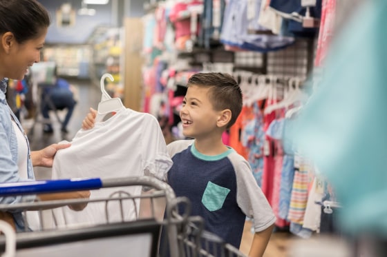 Image: Little boy shops with his mom