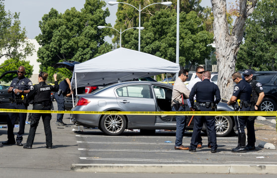Image: Police investigate the scene where a Cal State Fullerton administrator was fatally stabbed in Fullerton, Calif., on Aug. 19, 2019.