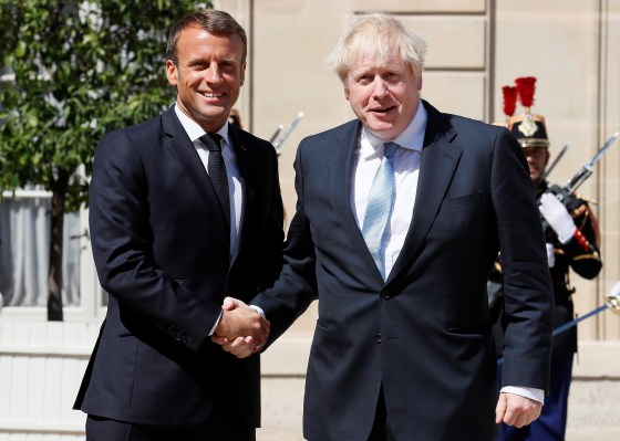 Image: French President Emmanuel Macron welcomes British Prime Minister Boris Johnson before a meeting on Brexit at the Elysee Palace in Paris